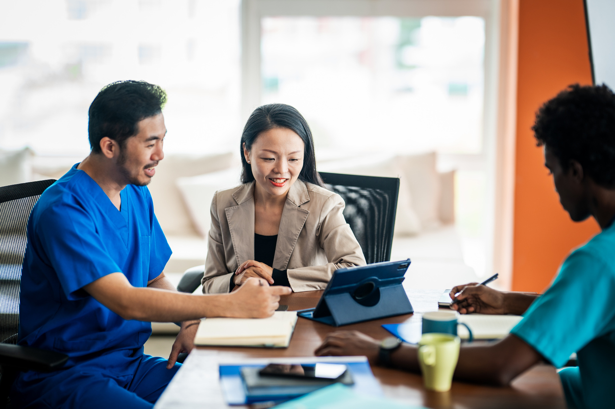 A caregiver supporting a client during a home visit