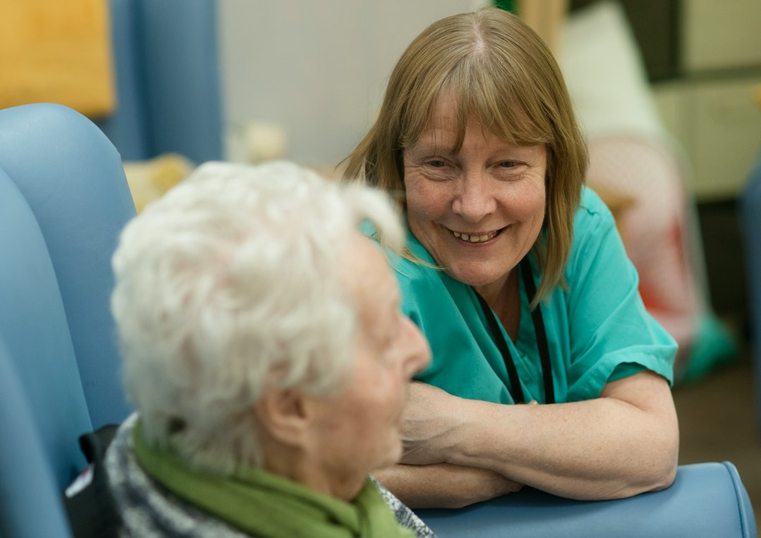 Caregiver attentively listening to a client