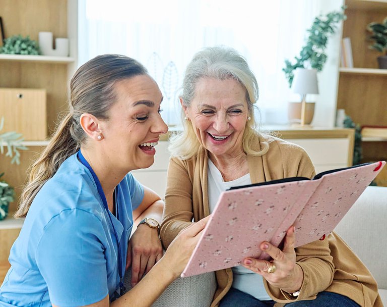 Caregiver spending time with a client at home